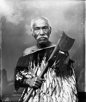 Maori man wearing korowai and carrying a tewhatewha 2